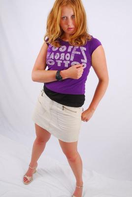 16P Natural redhead Judy models a black G-Shock watch while fully clothed