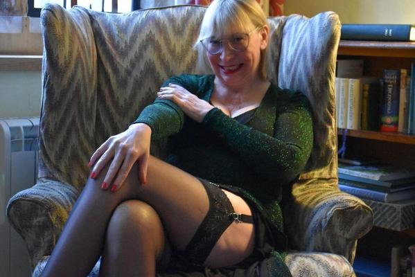 16P Older blonde lady Barby Slut shows her vagina during upskirt action on a chair