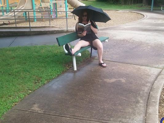18P Sweet amateur mom Bunny B flashes her twat on a bench on a rainy day