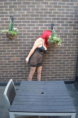 20P Older redhead Barby Slut exposes herself on the balcony of her condo