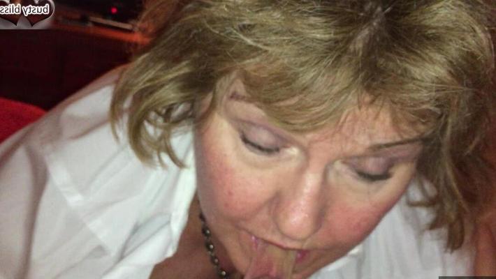 16P Mature woman Busty Bliss licks a penis while playing with a sex toy