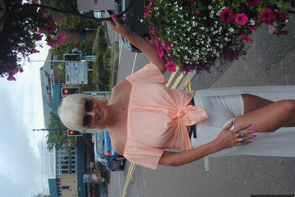 20P Mature British woman Denise Davies likes flashing her saggy tits in public