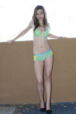 21P Amateur teen Dixie Green poses in striped underwear and heels on the terrace