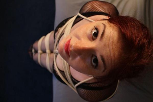 16P Redheaded fatty is silenced with medical tape while tied up with rope on a bed