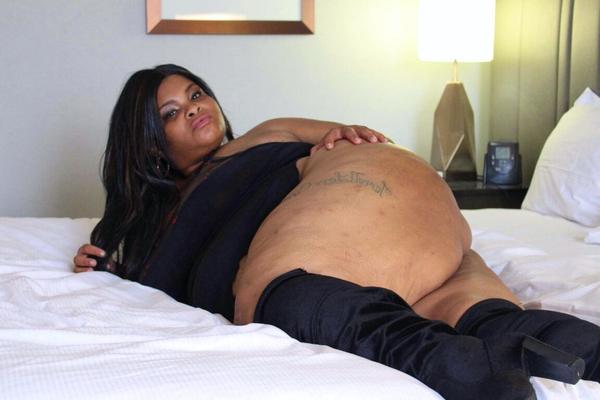 12P Ebony SSBBW Carmel Squirtz releases her massive ass from a black dress