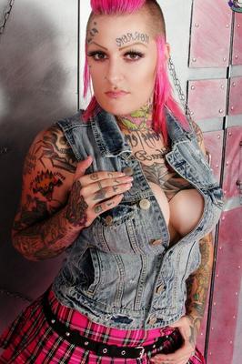 15P Tatted girl Miss Monster sports pink hair while inserting a bottle in her twat
