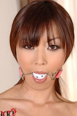 10P Naked Japanese model Marica Hase is left ball gagged and handcuffed on table