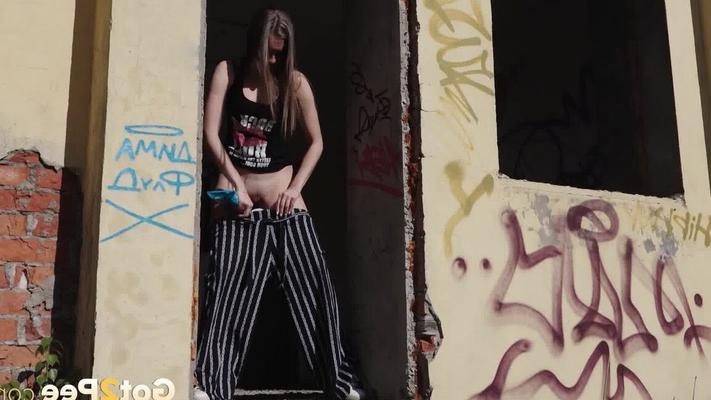 15P Sexy babe squats in abandoned building to piss