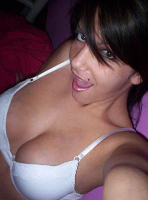 12P Nikki lifts her shirt to show off her huge perfect tits in a tight white bra