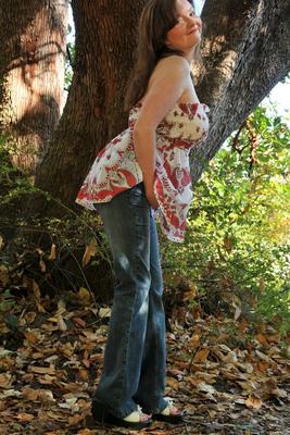 15P Curvy mature woman Tasty Trixie twerks her booty while disrobing in the woods