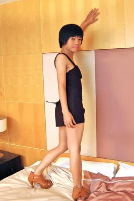 21P Short-haired Asian ladyboy Beybey rubs her tiny hairy dick on the bed