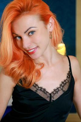 18P Pale redhead Beatrice Roja sets her slender figure free of black lingerie
