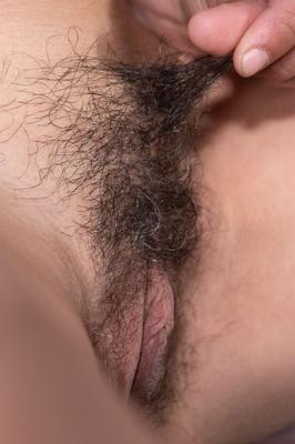 21P Mature brunette Soledad strips fully naked to show her delicious hairy pussy