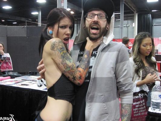 15P Tattooed girl Joanna Angel and her girlfriends welcome visitors to an XXX show