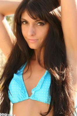 12P Brunette chick Courtney displays a pierced bellybutton while modeling a bikini