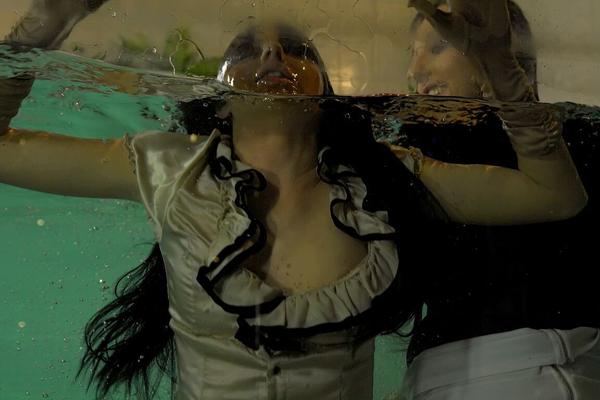 15P Fully clothed females expose tits and twats by jumping into an indoor pool