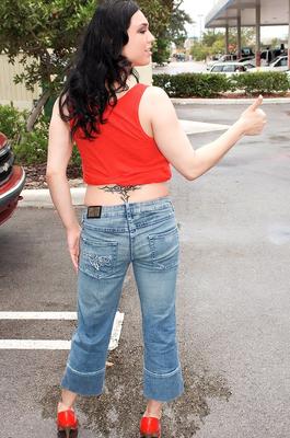 16P Brunette chick Isis Haze exposes her hooters in a car after hitching a ride