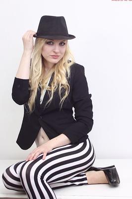 15P Natural blonde Bella Lei strips down to black heels on top of a table