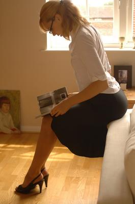12P Glamour model Joceline lifts up her black skirt to expose her sheer panties