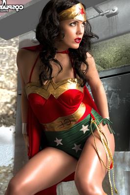 12P Beautiful brunette peels off her Wonder Woman outfit in a tempting manner