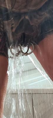 16P Tatted older woman Marie Bossette highlights her pierced pussy while showering
