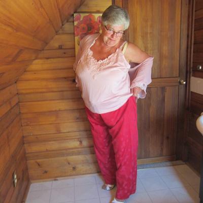 20P Naughty nan with short grey hair bares her big tits and butt with a striptease