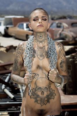 13P Bald inked babe Leigh Raven flaunts her small boobs and poses nude outdoors