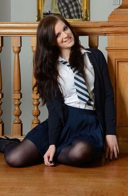 15P Tall girl Jessica-Ann Fegan peels off her school uniform on a landing