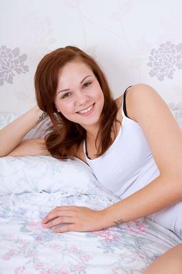 16P Young amateur Lilly May models in various states of undress on her bed