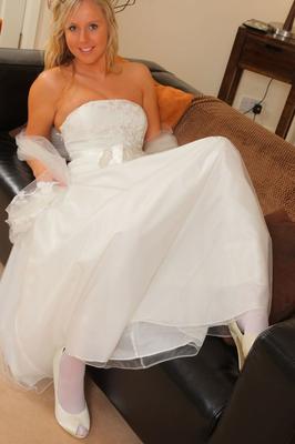 21P Beautiful babe Emma C takes off her wedding dress and shows feet in pantyhose