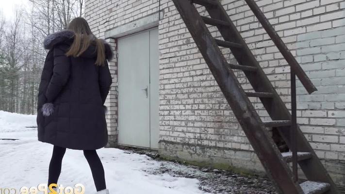 15P Caucasian girl pulls down her leggings to take a piss on snow-covered ground