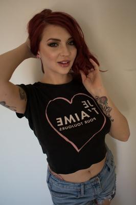 17P Redhead babe Amber Ivy bares her natural tits and takes off her tight shorts