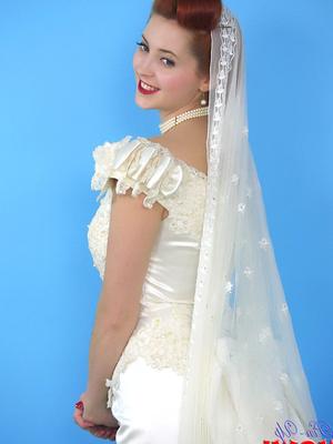 17P Natural redhead Lucy V slips off her wedding dress to bare big natural tits