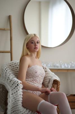 20P Cute blond teen admires her mirror reflection as she strips naked exposing her