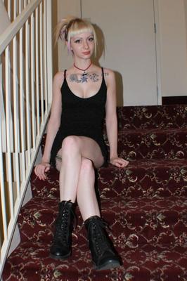 21P Tatted blonde Symone flaunting her sexy legs in a short black dress & boots