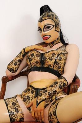 21P Busty latex-clad nympho Latex Lucy sucks her own toes in front of the mirror