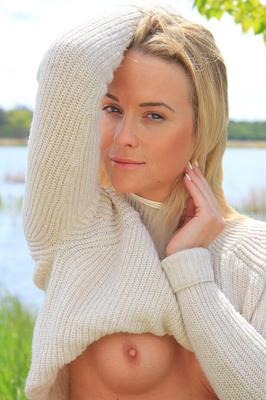 16P Young blonde Cristal Caitlin lifts up her sweater while bottomless by a river