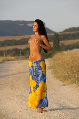 16P Gorgeous model Macy B drops her sarong to pose on the road with tiny tits bare