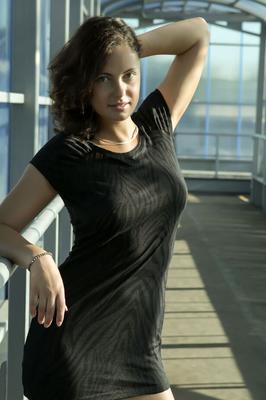 16P Teen model Eunice O uncovers her full breasts while getting naked on a walkway