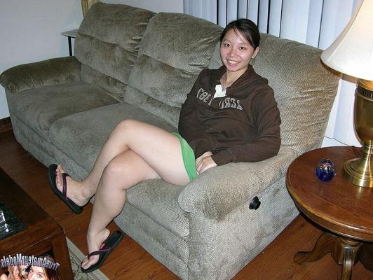 17P Barely legal Asian girl wears nothing more than a smile while showing her twat