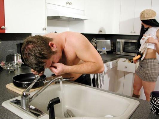 16P Cute and playful girl with strapon humiliates a guy in the kitchen with her