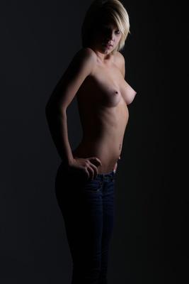 16P Blonde amateur Tiffany stands naked in poor light while wearing heels