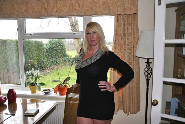 20P Older blonde amateur Melody sets her firm breasts free in a thong