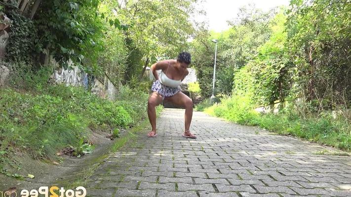 15P Distressed girl Chloe Lamour takes a piss on a cobblestone walkway
