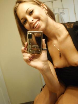 16P Lusty young amateur Riley takes photos of her small tits and juicy ass
