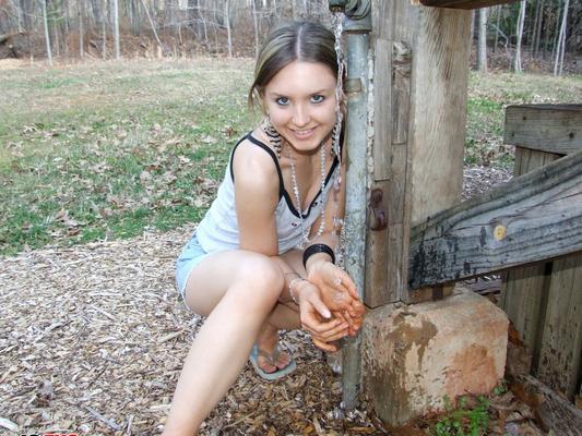 12P Cute blonde teen Shelby teases at the public park in her skimpy little outfit