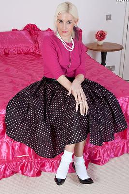 15P Blonde retro girl Krystal Niles shows off the soles of her nylons on her bed