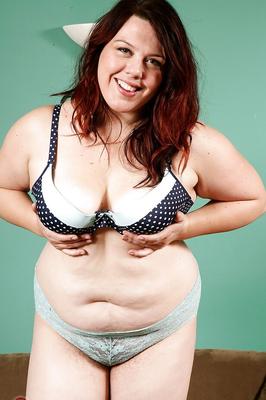 16P Mature overweight woman slides panties to one side to reveal hairy snatch