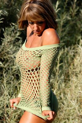 15P Fitness model Heather Bartosh poses for a solo shoot afore long grasses