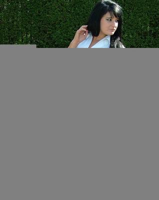16P Dark haired female displays some leg and her stiletto heels on a park bench